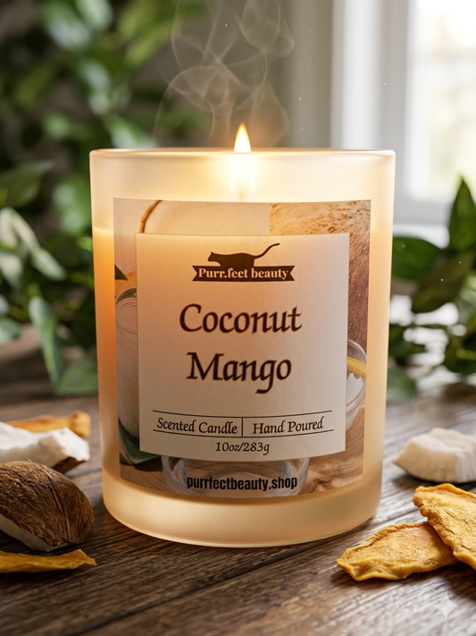 Coconut Mango scented candle with a label on a wooden surface, surrounded by natural elements.