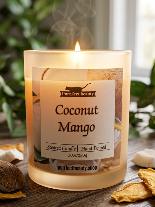 Coconut Mango scented candle with a label on a wooden surface, surrounded by natural elements.