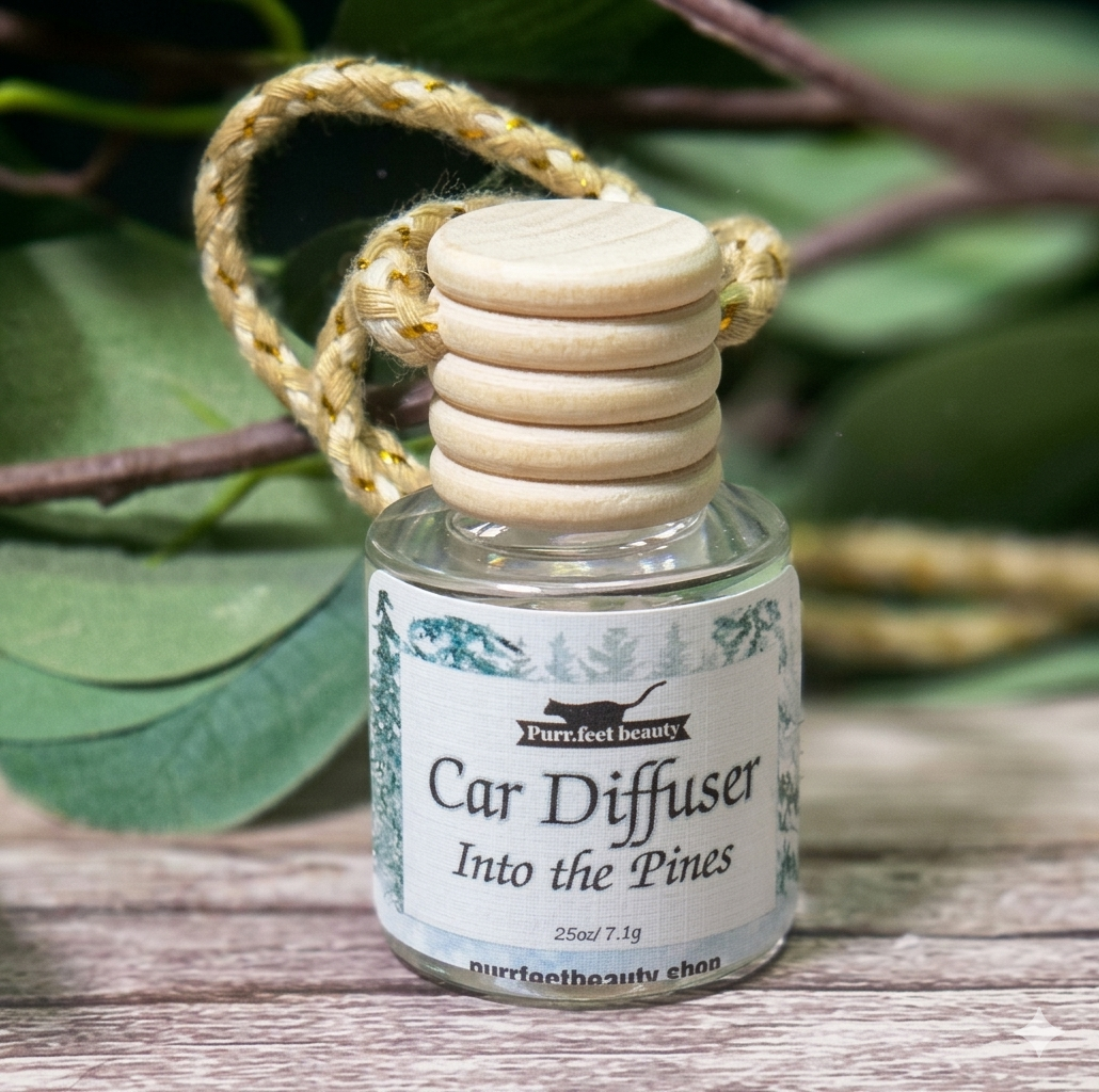 Car diffuser labeled 'Into the Pines' on a wooden surface with green leaves in the background